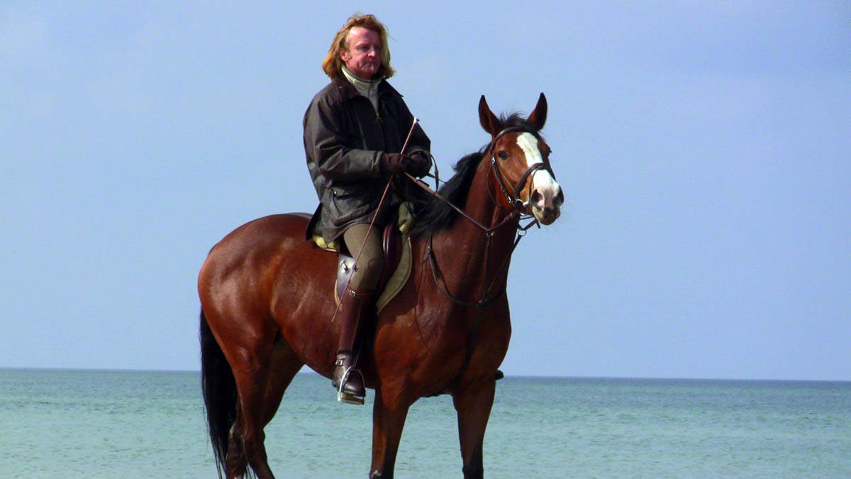 The "Count" of Warnemuende rides his horse on the beach